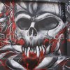 Grafitti przedstawiające diabelską czaszkę na murze przy ulicy Cysterskiej